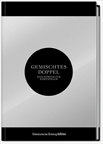 Buch Gemischtes Doppel mit silbernem Cover und schwarzem Kreis
